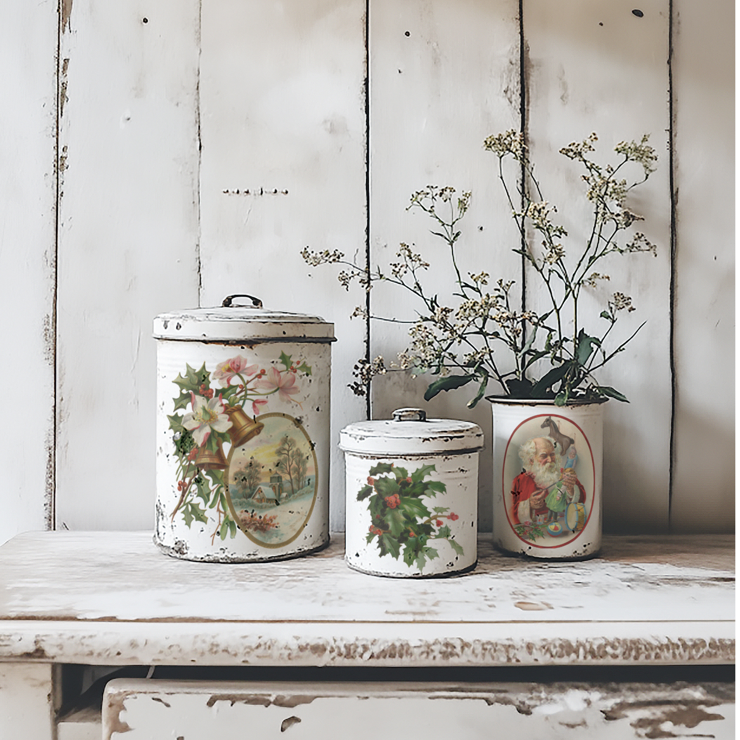 "Christmas Joy" IOD Transfer by Iron Orchid Designs. Available at Milton's Daughter. Pic 2. Three vintage-style ceramic canisters with decorative lids on a wooden surface.