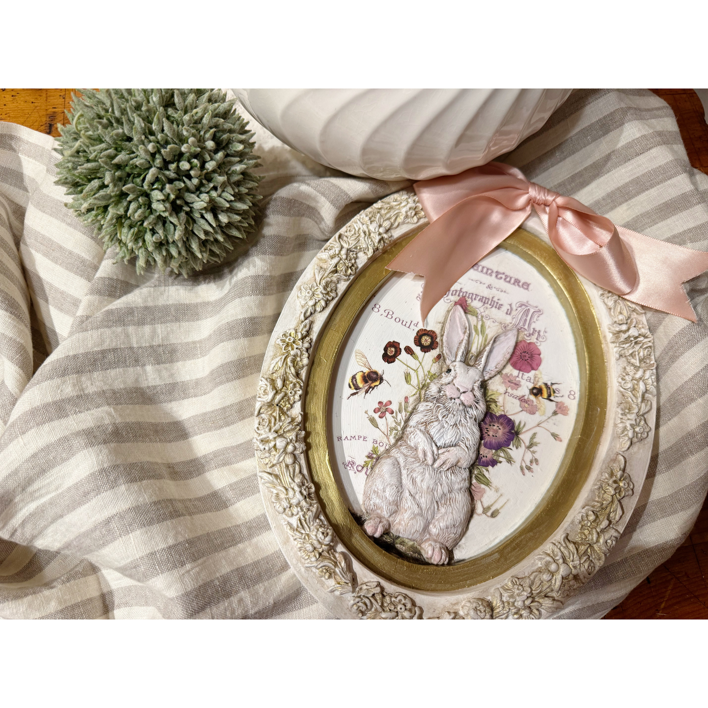 Decorative framed picture with a rabbit on a floral background