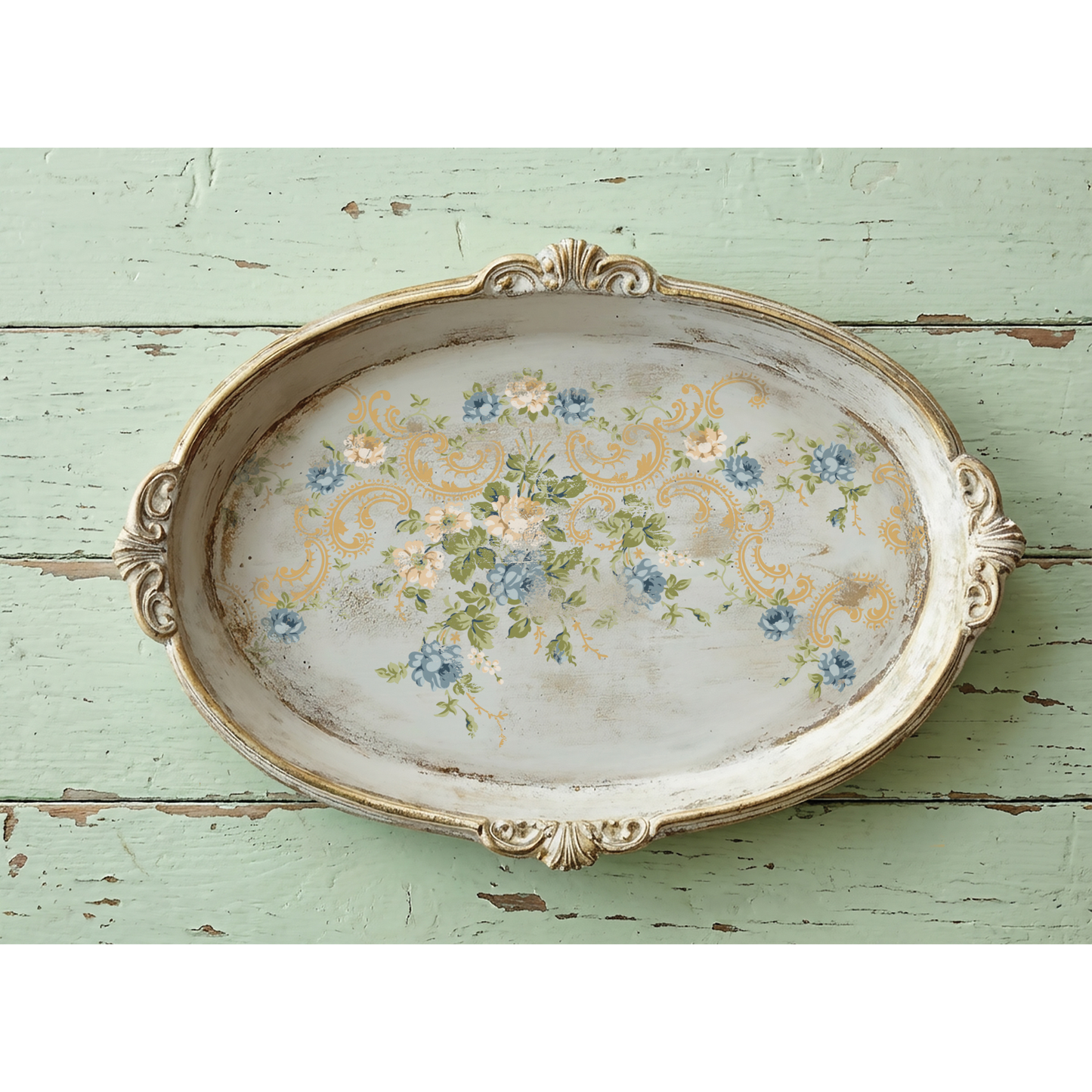 Decorative oval tray with floral design on a rustic wooden surface