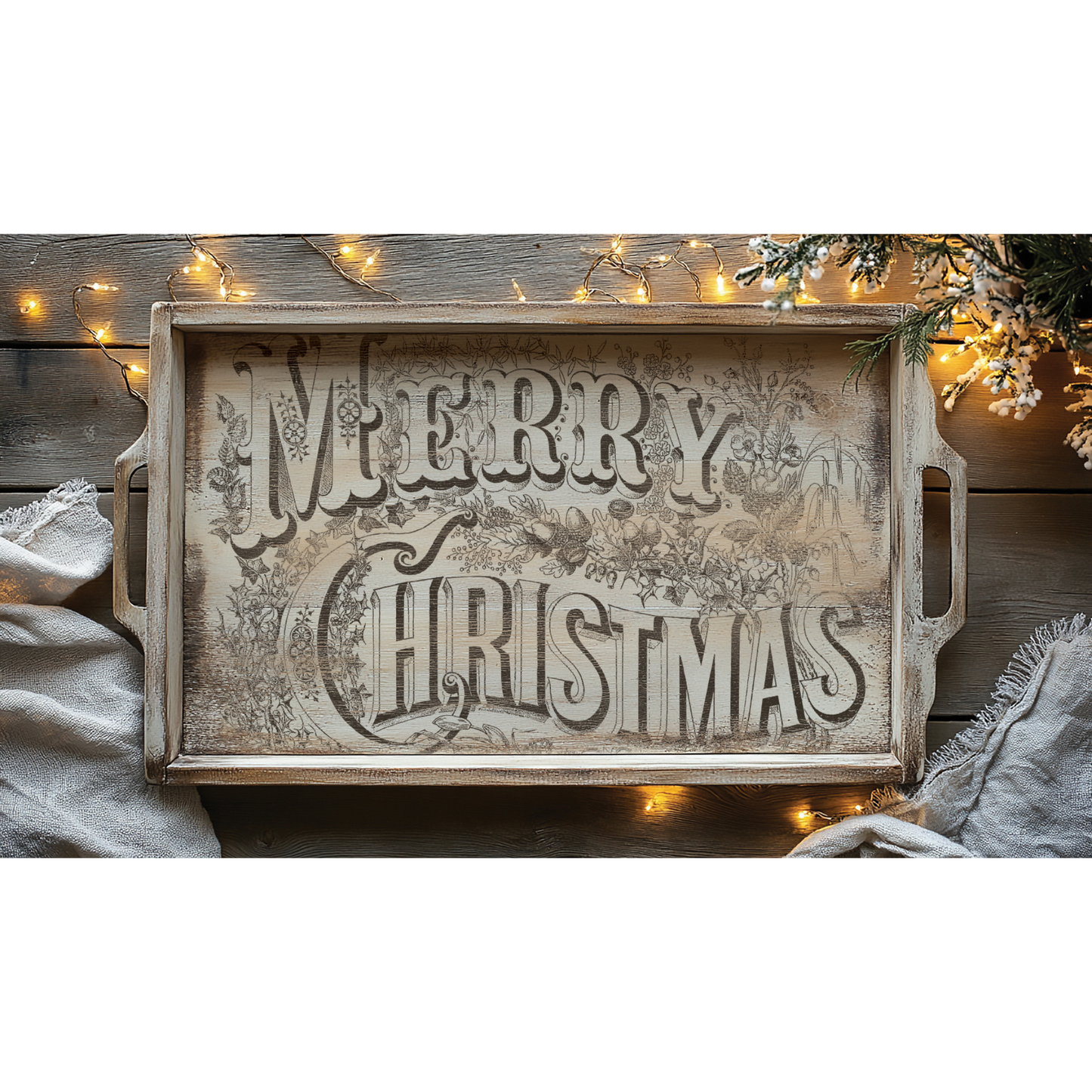 "Twelfth Night" IOD Paint Inlay by Iron Orchid Designs. Example pic 1. Transfer available at Milton's Daughter. Wooden tray with 'Merry Christmas' text on a wooden surface with string lights and a tree.