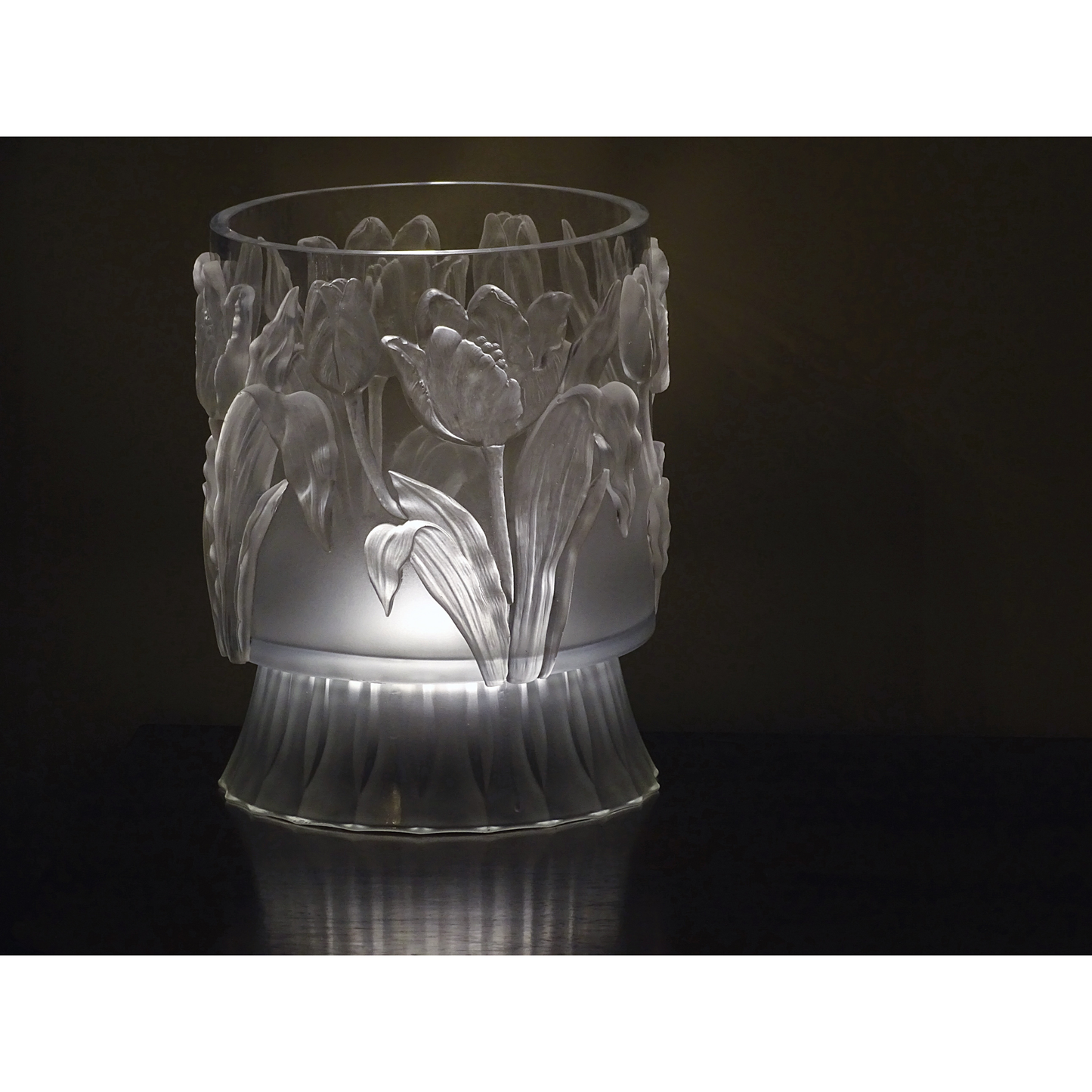 Decorative glass vase with Tulips patterns on a dark background