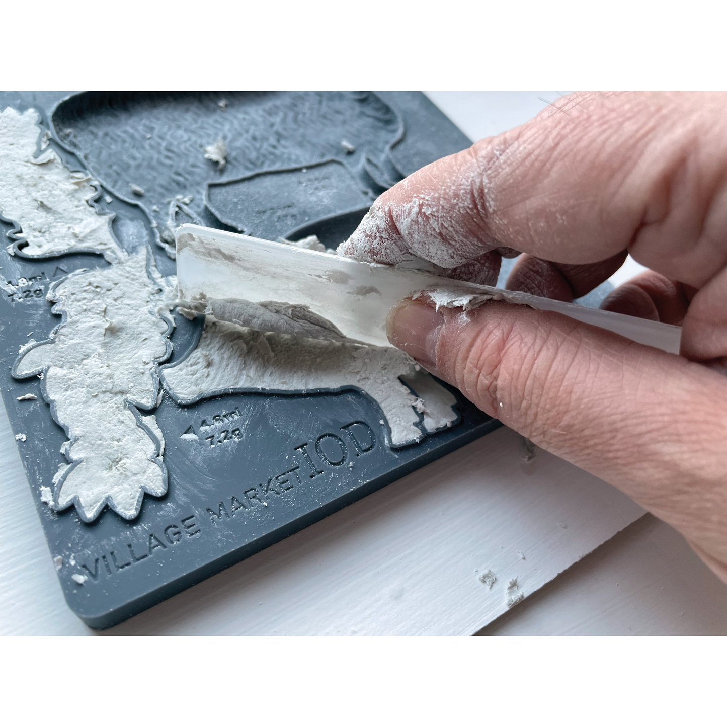 Village Market IOD Silicone Mold by Iron Orchid Designs. Example of clay application. Mould measures 6" x 10." Available at Milton's Daughter.