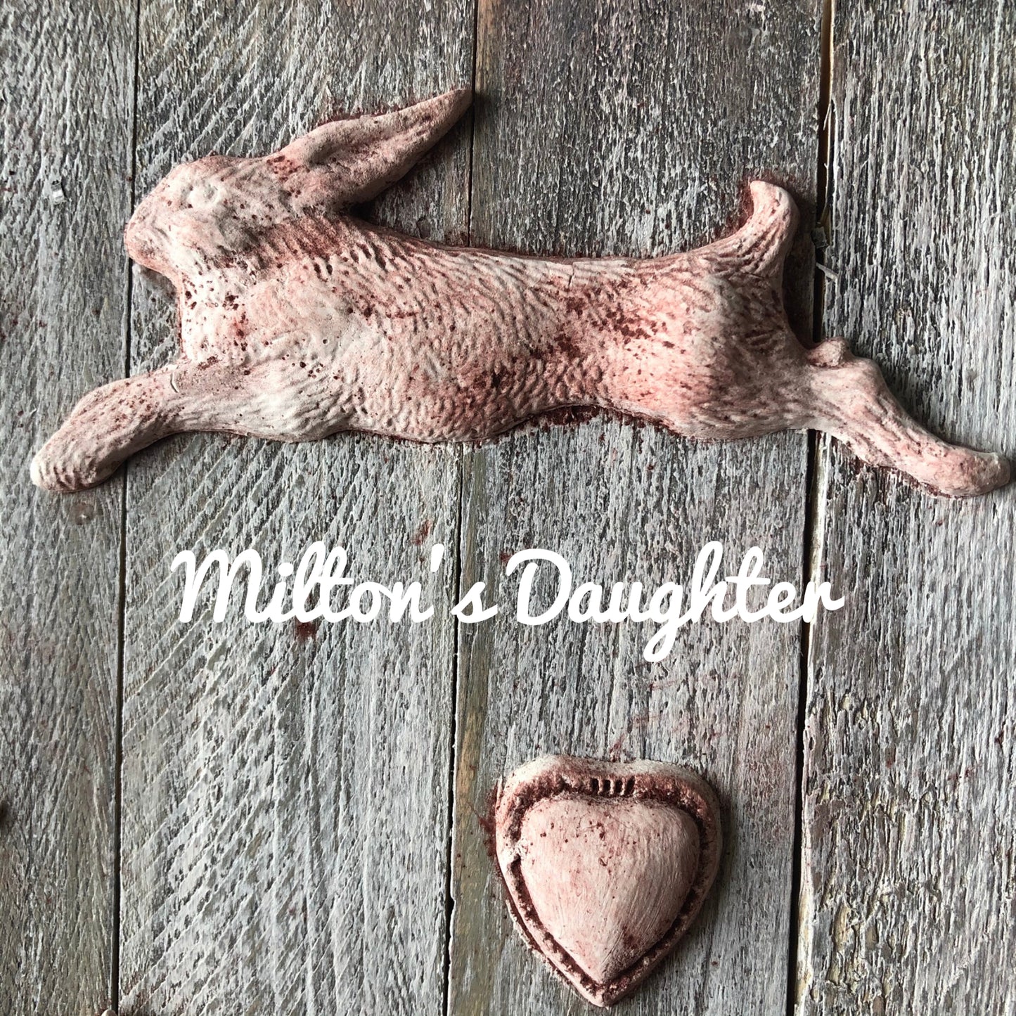 IOD Fleur De Lis Mold castings of running hare and heart mounted on wood at Milton's Daughter
