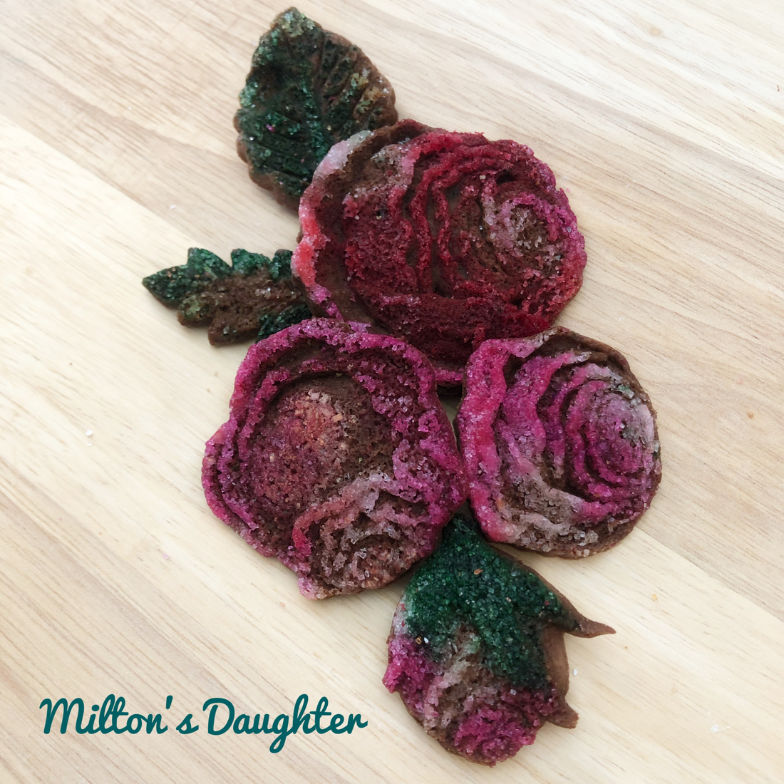 Chocolate sugar clookies encrusted with pink and green sanding sugar, baked in mold using Heirloom Roses Mold by IOD by Milton's Daughter