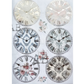 Six decorative clock faces with floral and vintage designs on a white background
