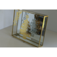A rectangular glass jewelry box with a gold metal frame, featuring gold and silver Christmas tree and floral transfer designs on the mirrored lid, set against a neutral light gray background.