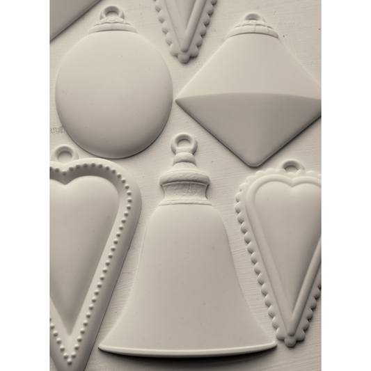 "Bibelots 2" IOD Mould by Iron Orchid Designs. Silicone mold with various geometric ornament shapes. Casting example. Available at Milton's Daughter. 