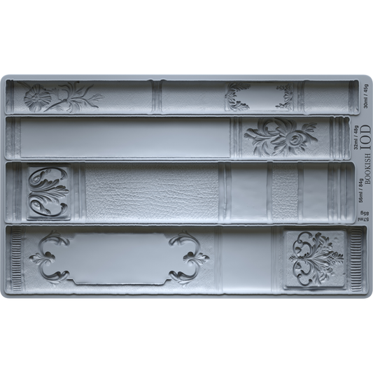 Decorative silicone mold with intricate book spine patterns on a white background