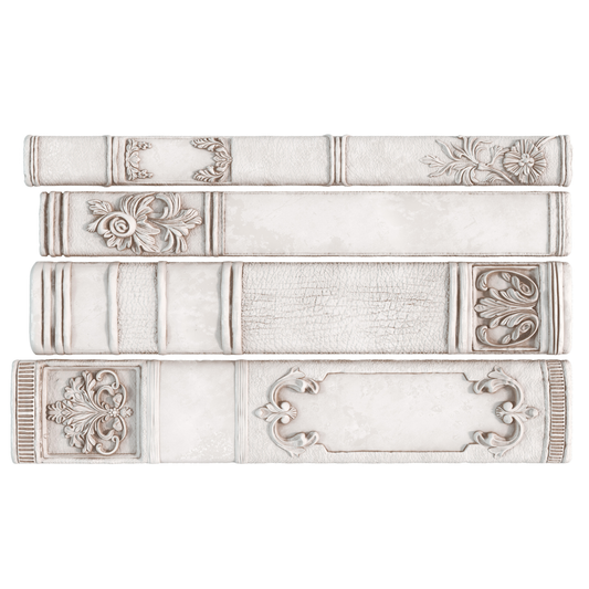 Decorative castings of book spine patterns on a white background