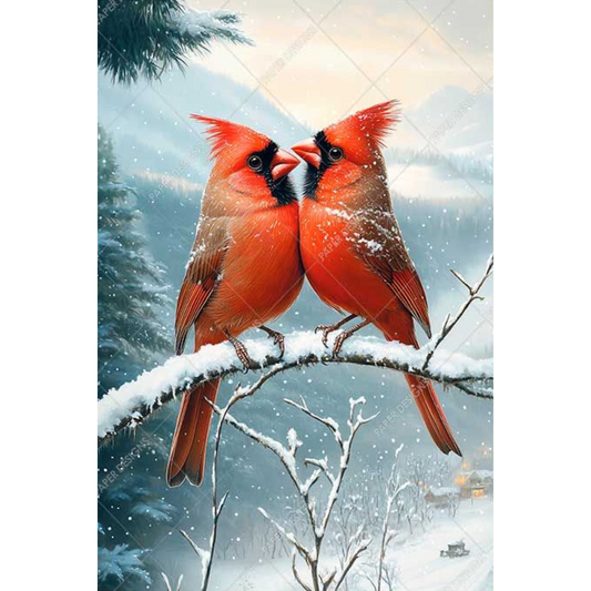 Two red cardinals on a snowy branch with a winter landscape background.