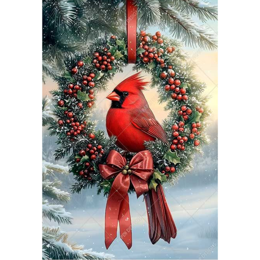 Red cardinal bird on a Christmas wreath with berries and a bow against a snowy background.