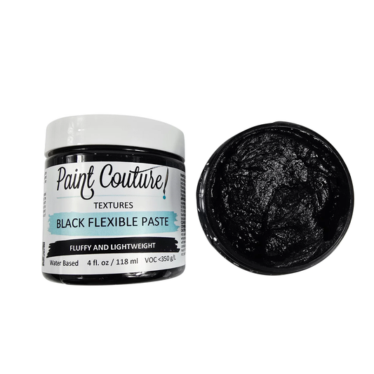 Black flexible paste jar with open lid on a white background