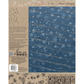 IOD Flurry Stamp by Iron Orchid Designs, Back cover, featuring a blue wood-plank design with white snowflakes, a beige back panel with product details, and branding for Iron Orchid Designs.