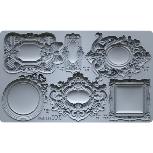 Decorative silicone mold with intricate frame designs on a gray background