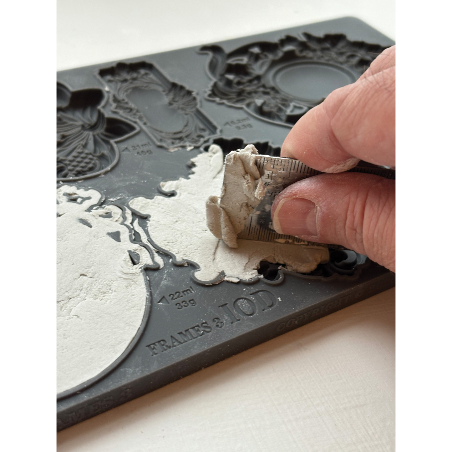 product example of IOD Frames 3 Mould being used with air dry clay.
