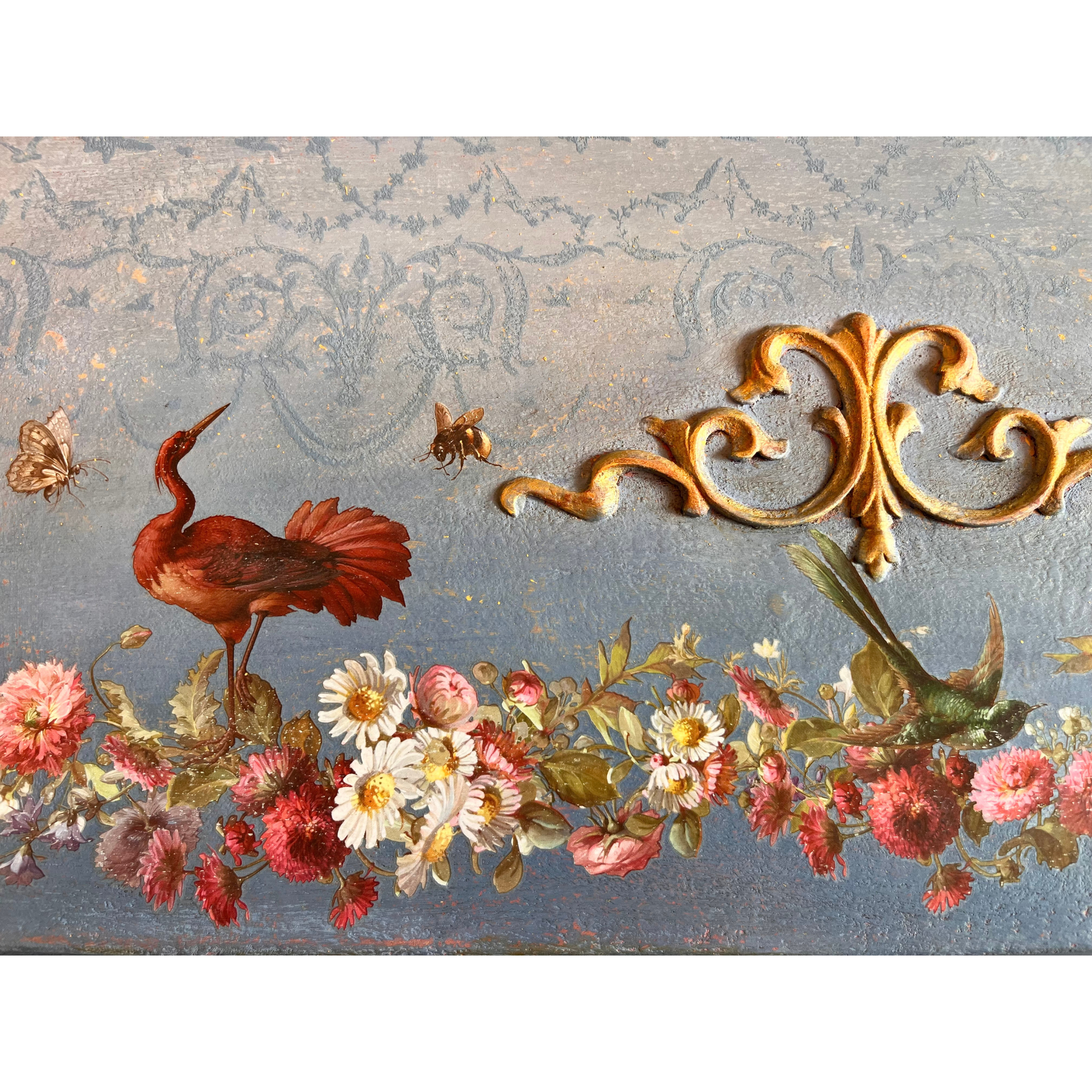 Decorative design detail with birds, flowers, and gold embellishments on a textured background