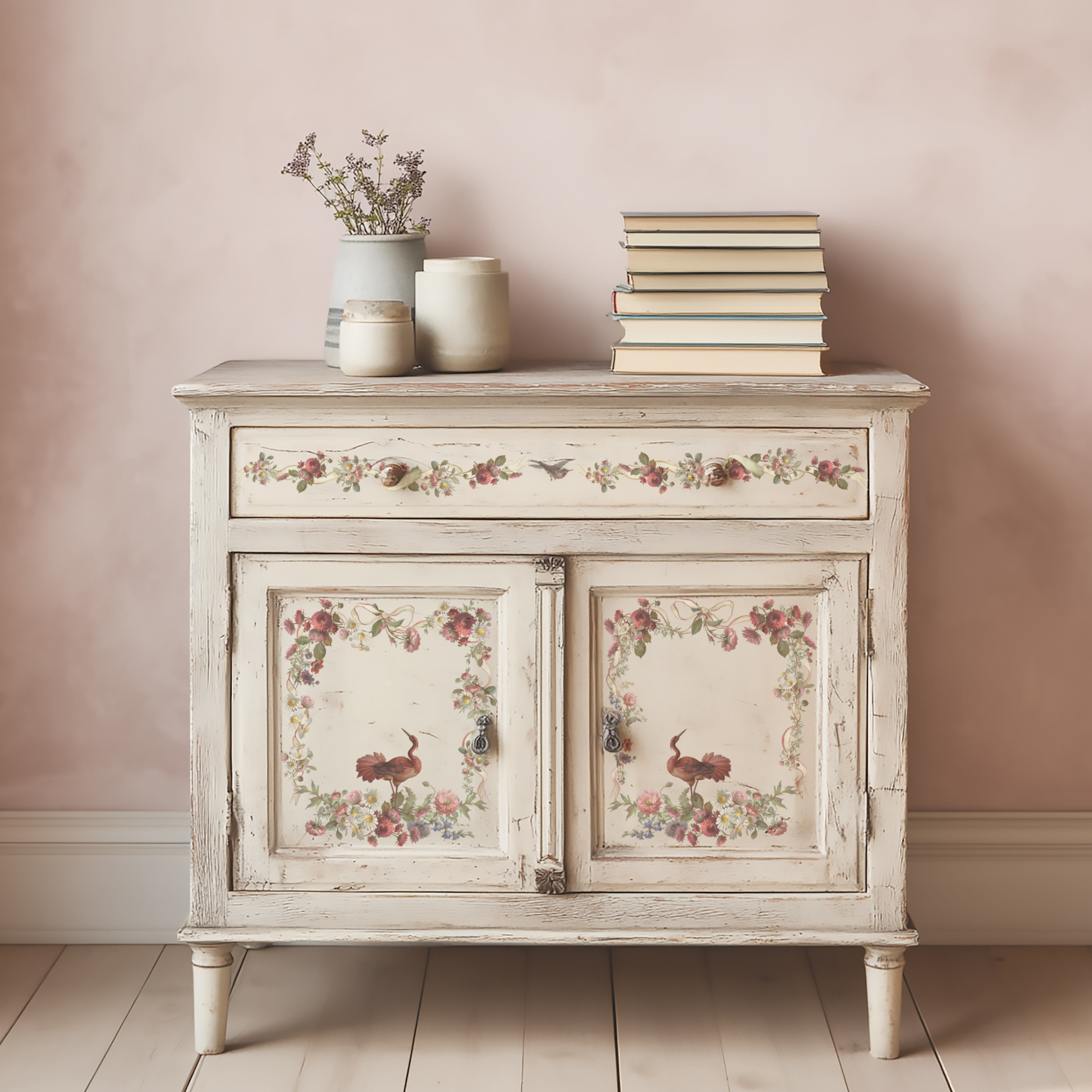 Vintage-style sideboard with floral patterns against a pink wall