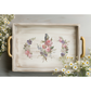 Decorative tray with floral and bird design on a light background