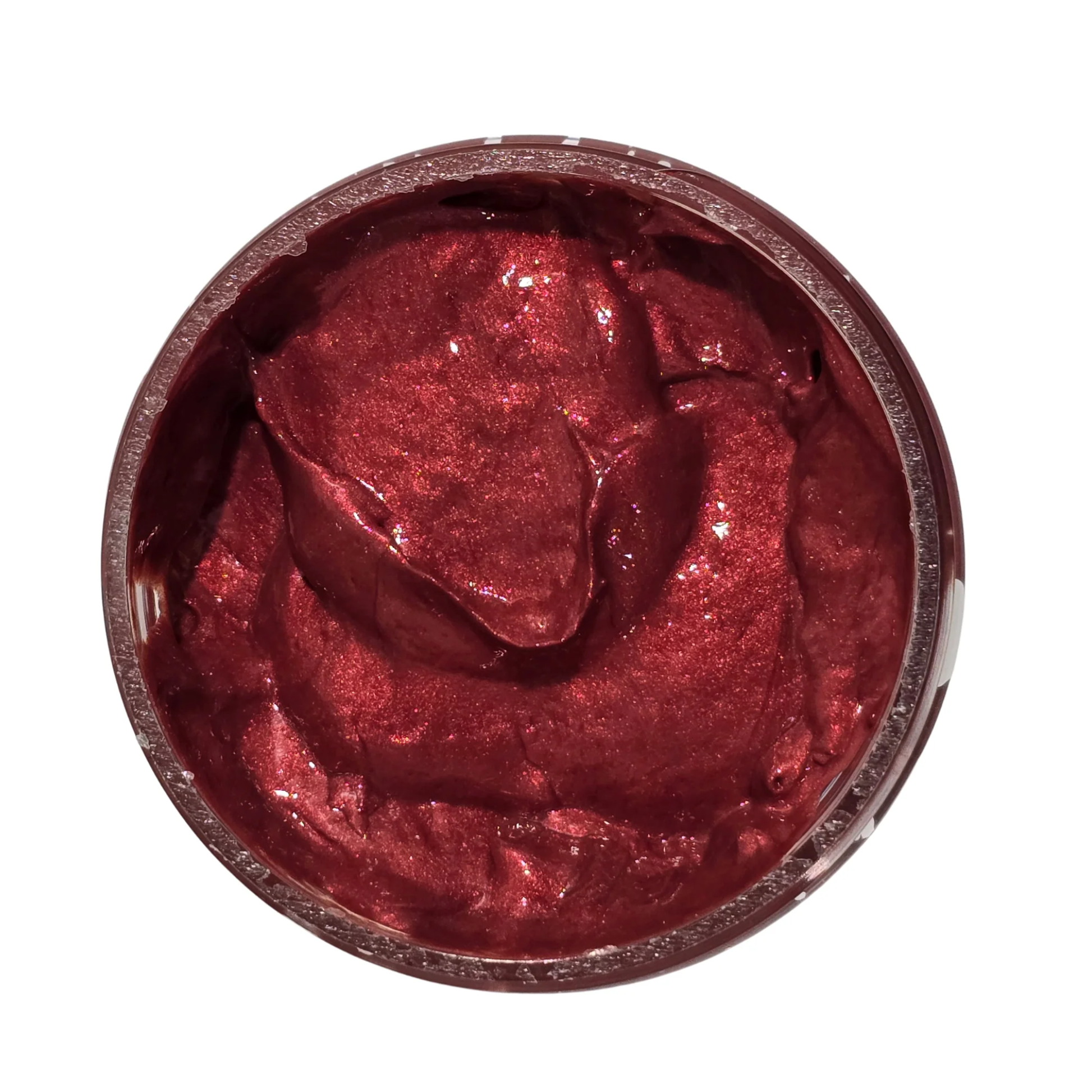 Reddish-pink colored paste in a jar on a white background.