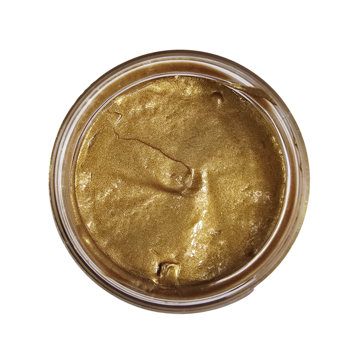 Gold colored paste in a jar on a white background.
