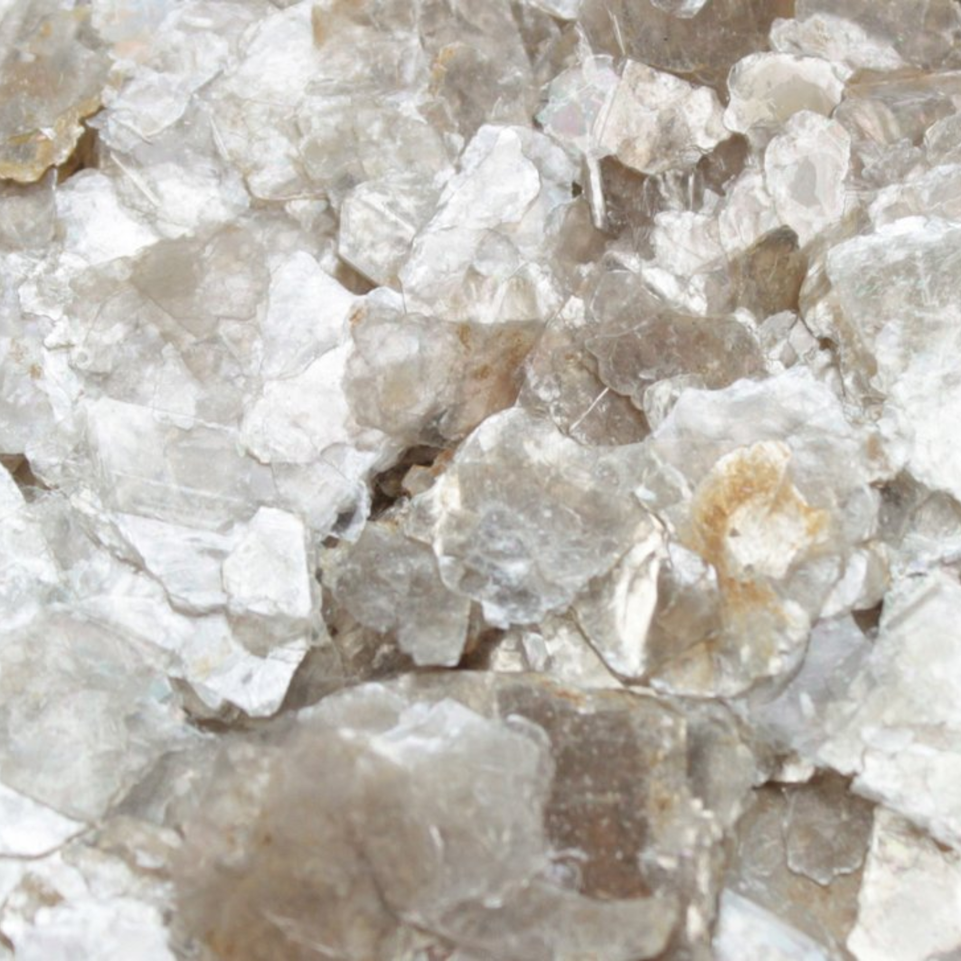 Close-up of raw crystal stones with a beige and brown color.