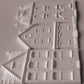 IOD Mould Old Colchester Road castings, featuring  detailed house designs with windows, doors, and textured brick patterns, arranged on a light gray background.