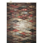 Distressed harlequin patterned paper with diamond shapes in dark colors.