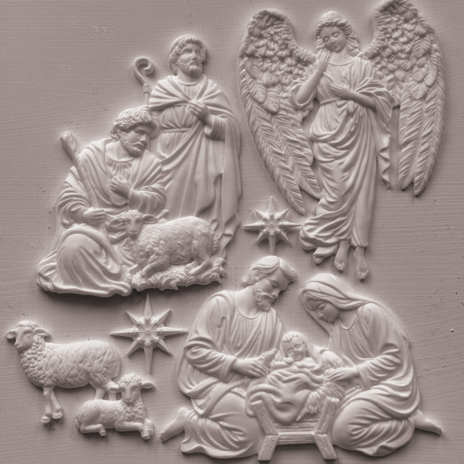 Castings of IOD Mold SIlent Night, featuring nativity scenes with Mary, Joseph, baby Jesus, sheep, and two angels on a textured light gray background.