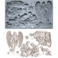 IOD Mould SIlent Night, featuring detailed Christmas nativity and angel designs, shown both in its gray silicone form and as the finished light beige castings.
