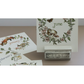 A set of imonthly calendar cards displayed on a small stand, with one card standing upright showing June and others partially visible showing January and February. The cards feature vintage botanical and animal IOD transfers in muted green, pink, and brown tones on an off-white background.