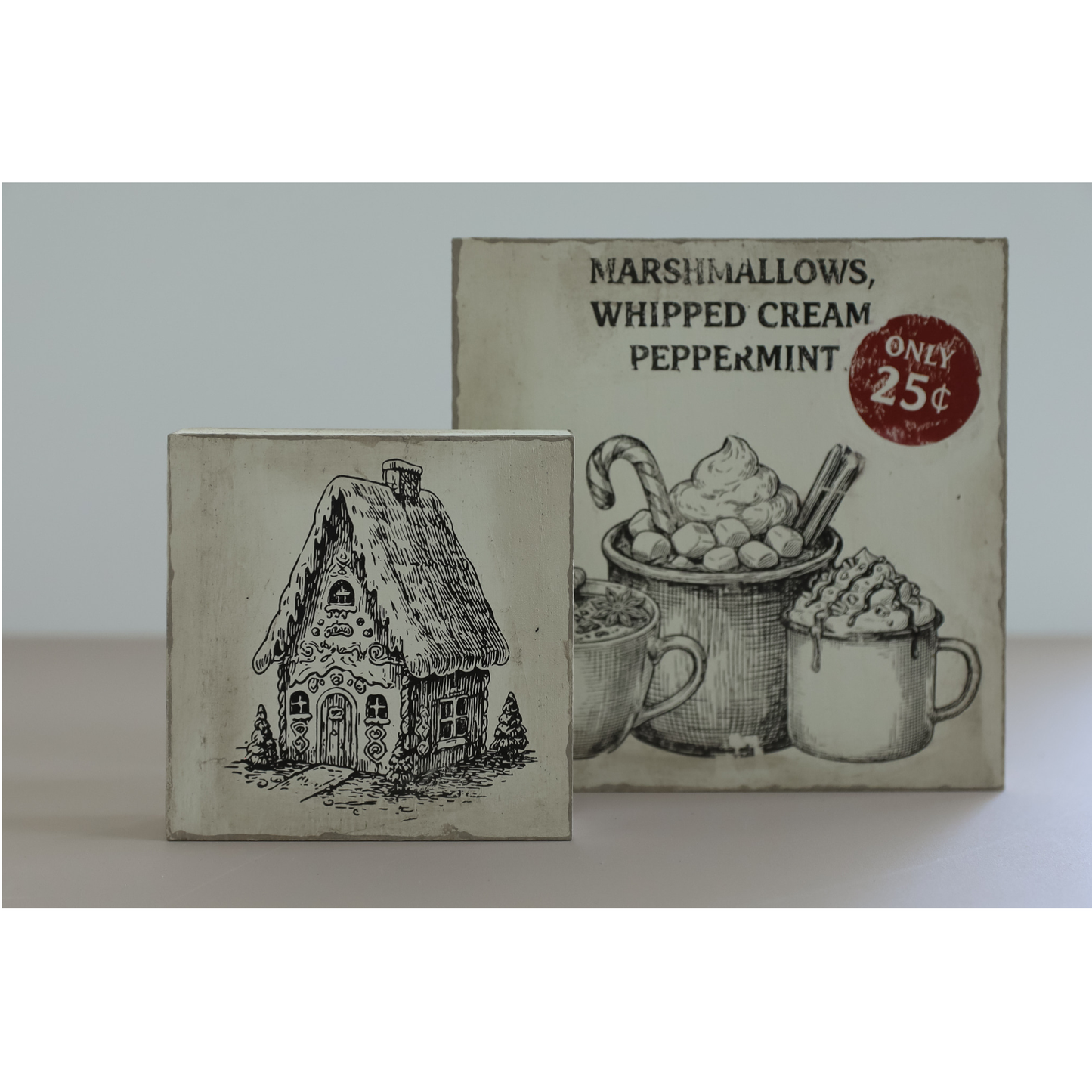 Two vintage style decorative signs featureing a gingerbread house and and advertisement for marshmallows, whipped cream and Peppermint, only 25 cents.