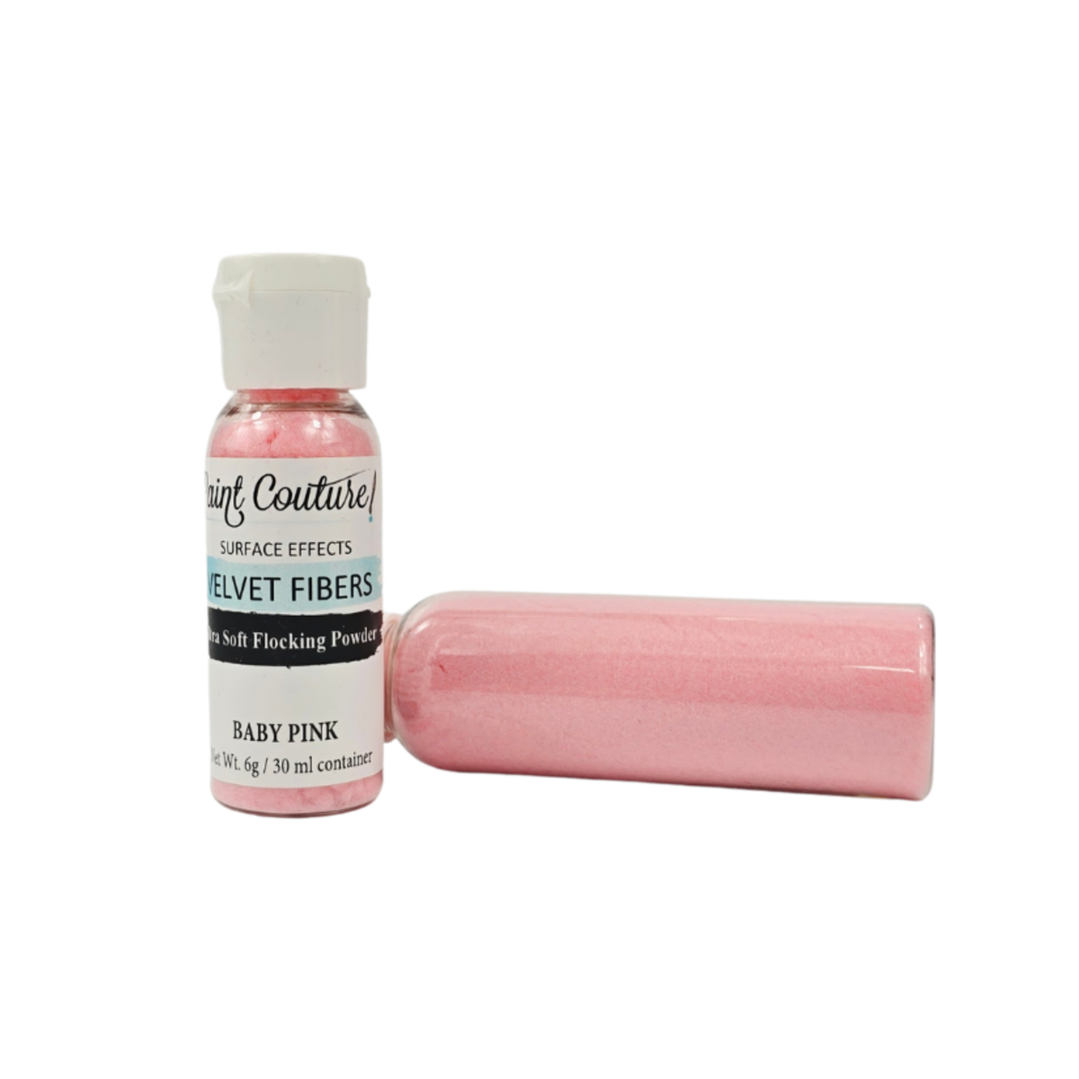 A small bottle of Paint Couture Velvet Fibers in Baby Pink, shown next to a cylindrical container filled with the same pink flocking powder, on a plain white background.