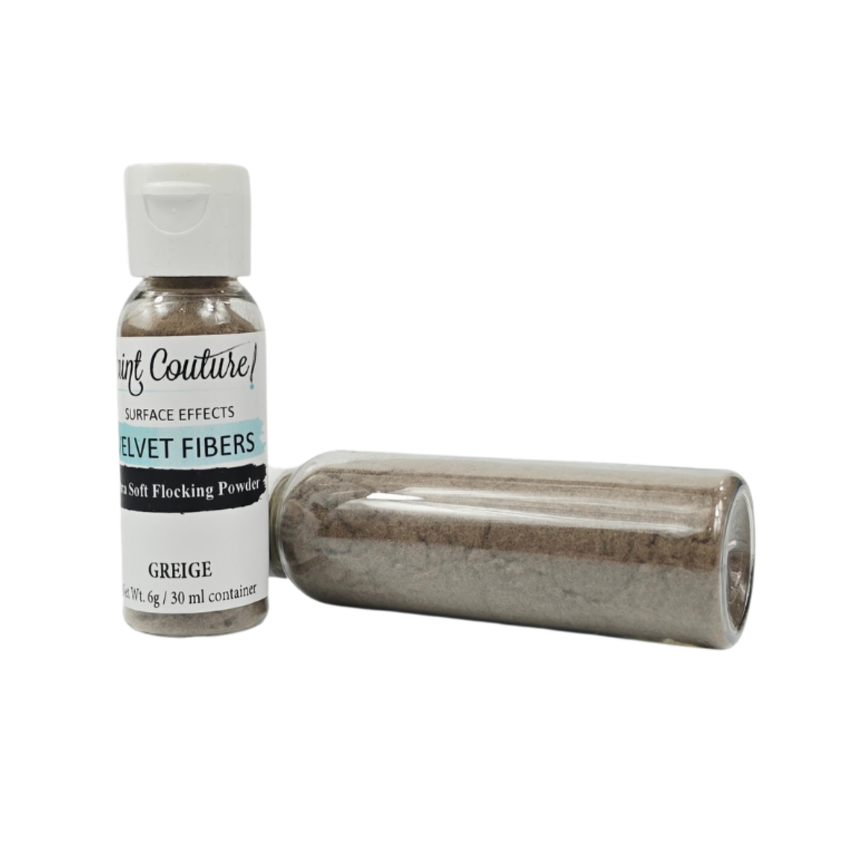 A small bottle of Surf Couture Velvet Fibers in Greige, shown next to a clear plastic cylinder filled with the same grayish-brown flocking powder, on a plain white background.