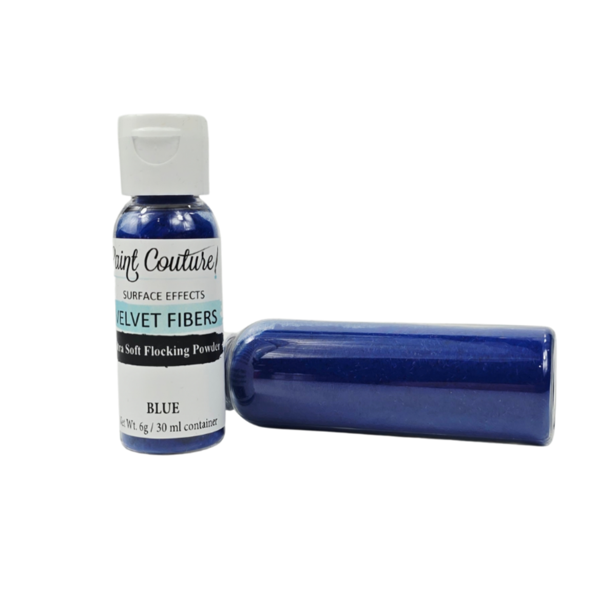 A bottle of Paint Couture velvet fibers surface effect powder in the color Blue, shown next to a cylindrical container filled with the blue powder, on a white background.