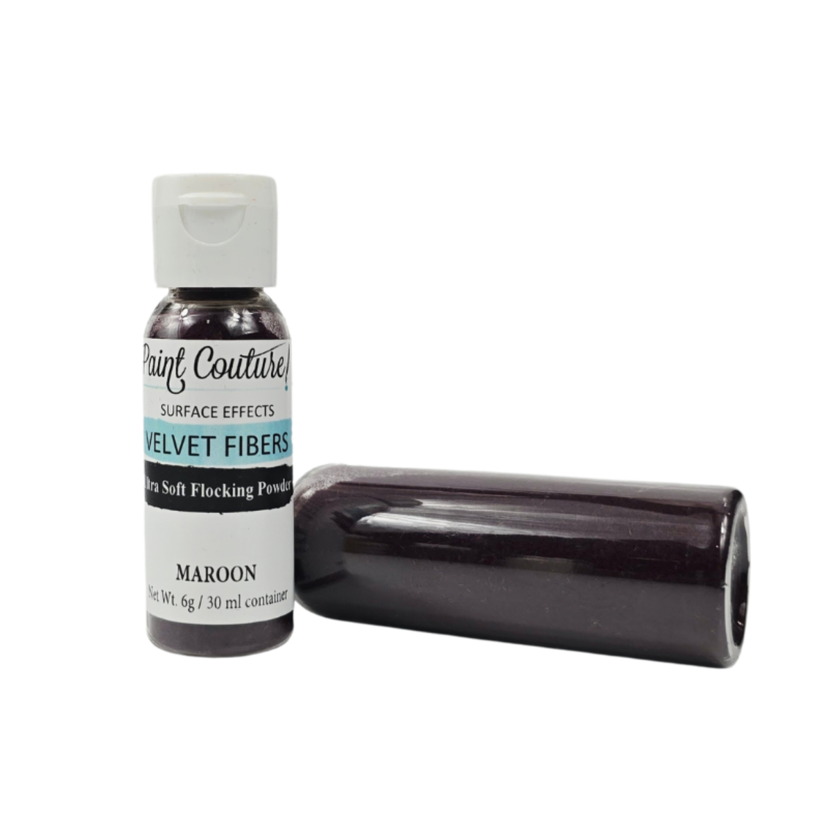 A bottle of Paint Couture Velvet Fibers surface effect soft flocking powder in the color Maroon, shown next to a dark maroon cylindrical container on a white background.