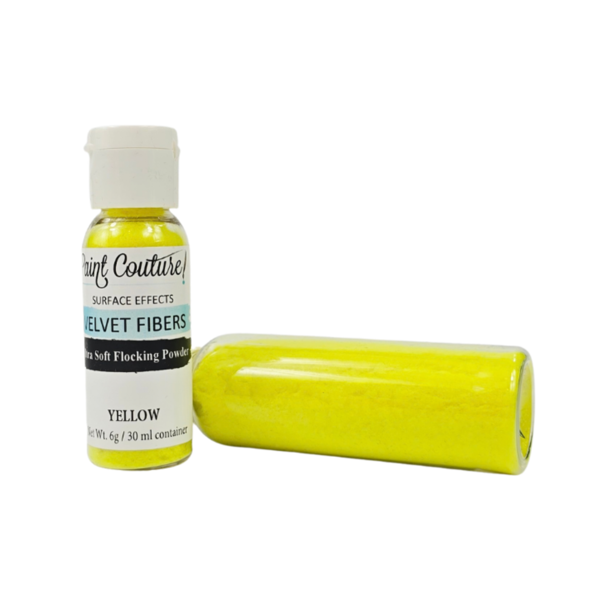A bottle of Paint Couture Yellow Velvet Fibers soft flocking powder next to a clear plastic tube filled with bright yellow powder, on a white background.