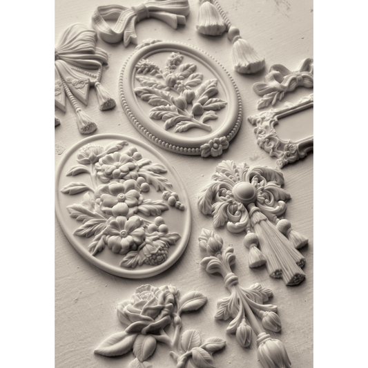 "Victoriana" IOD Silicone Mould by Iron Orchid Designs. Available at Milton's Daughter. Decorative mold with florals, tassels and cameos. Casting example.