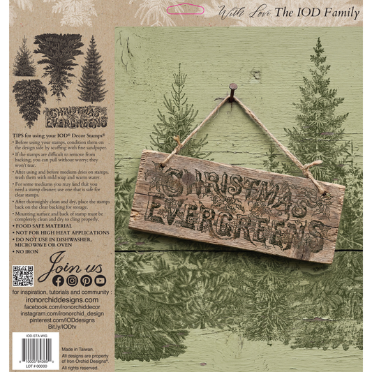 Back packaging  of IOD Stamp Winter Grove by Iron Orchid designs, featuring a rustic wooden hanging sign with the phrase 'Chirstmas Evergreens' over a green forest background illustration.