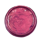 Open jar of deep pink metallic paint on a white background.