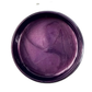 Purple metallic paint in a round container on a white background