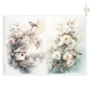 A decorative paper featuring two watercolor-style floral scenes: a bird perched on a branch above a small birdhouse with pink blossoms on the left, and white flowers with green leaves and blush buds on the right, set against a soft cream and pale blue background.