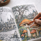 Coloring book with mushroom illustration and hand holding a pencil