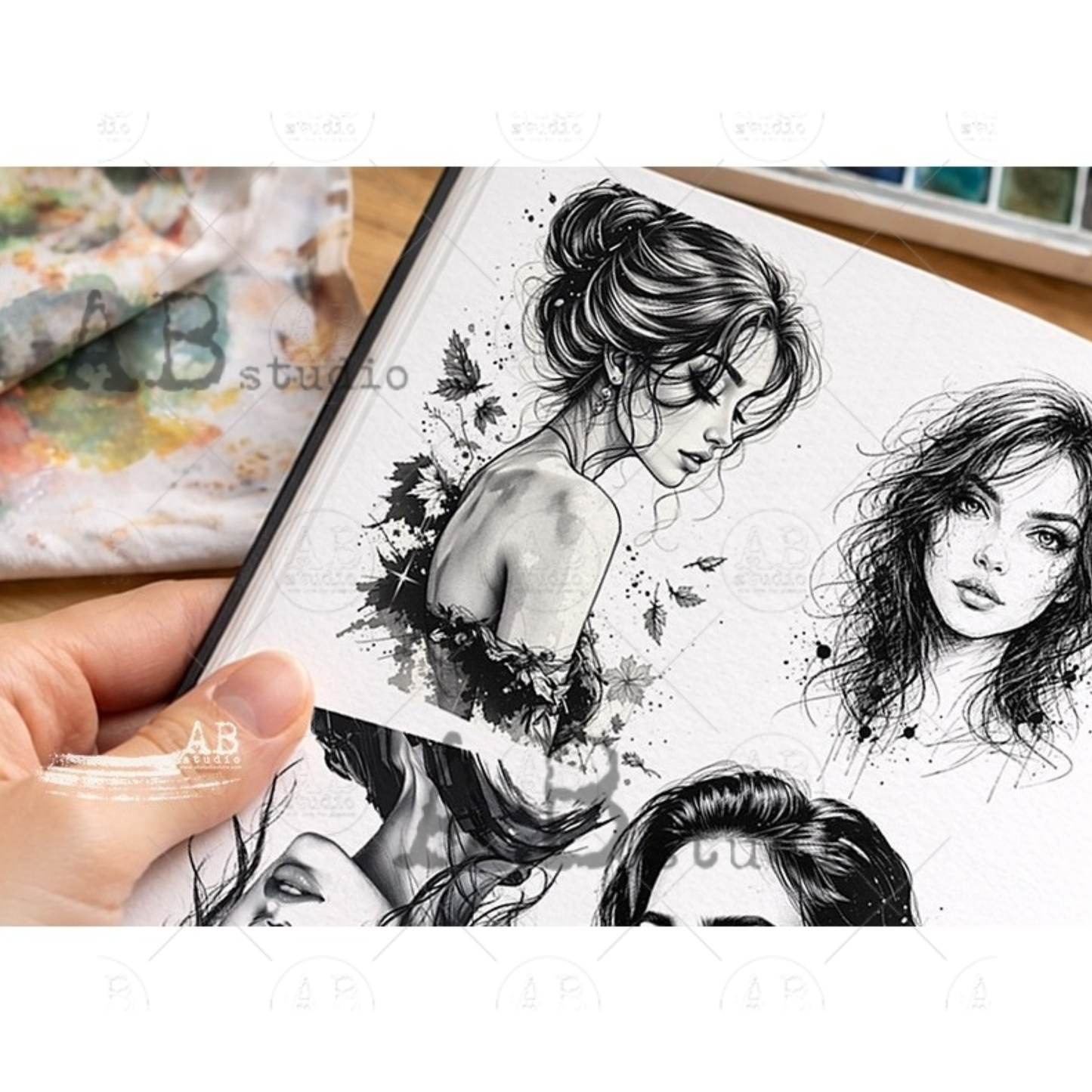 Sheet of black and white illustrations held by a hand, with 'AB Studio' branding.