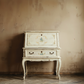 Vintage desk with floral patterns against a worn wall