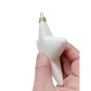 White star shaped ornament with gold accent held by a hand - side view.