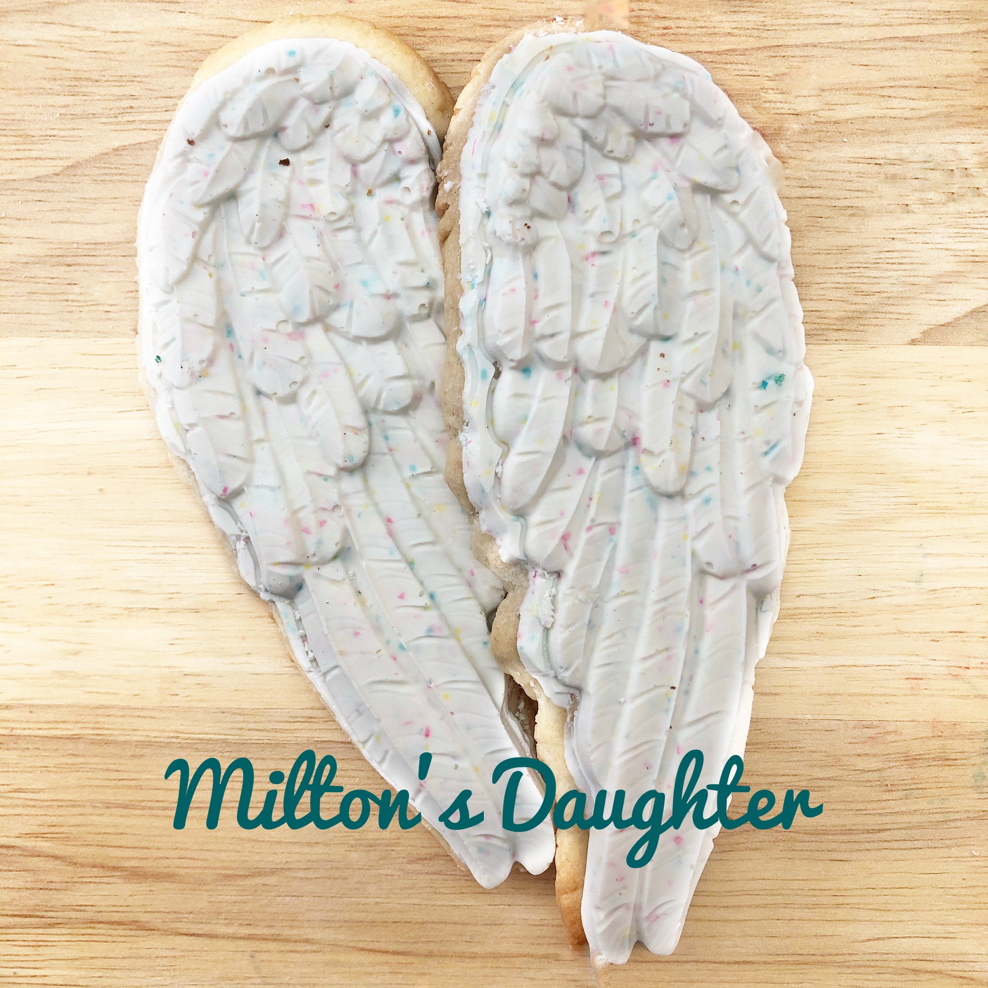 Wings and Feathers IOD Mold white chocolate castings on sugar cookies by Milton's Daughter