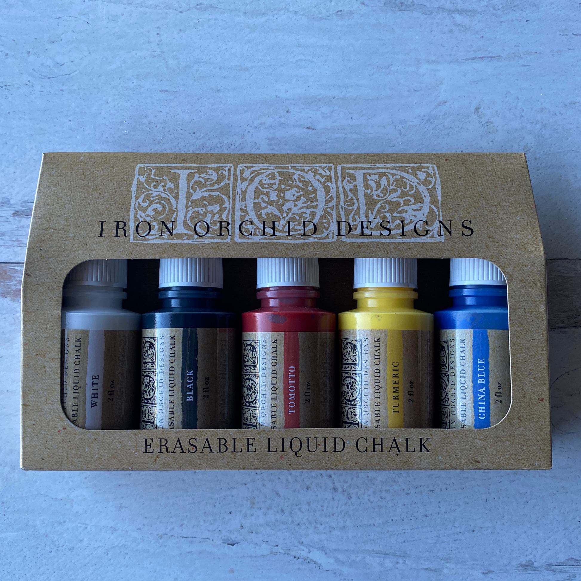 IOD Erasable Liquid Chalk product photo. 5 pack of yellow, red, blue, black and white available at Milton's Daughter